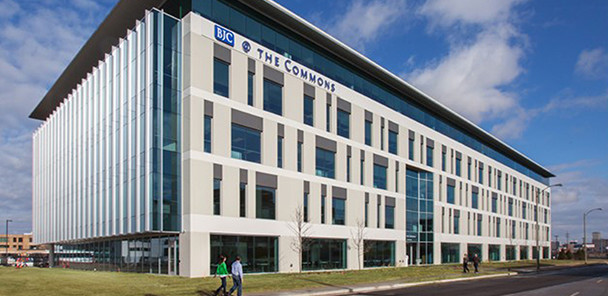 Artist's rendering of BJC Commons, a beige and blue-glass office building.
